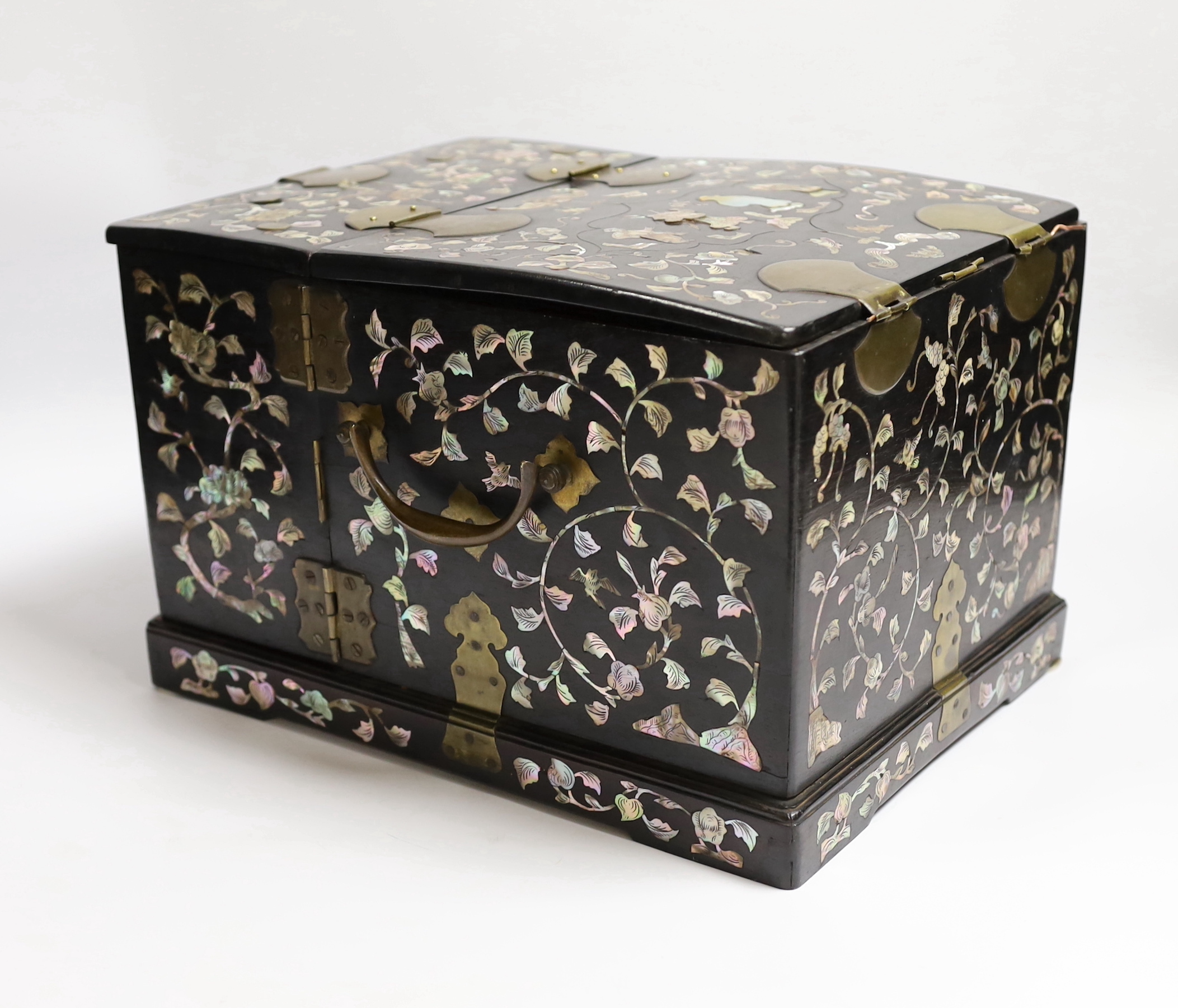 A Chinese mother-of- pearl inlaid hongmu vanity cabinet, late Qing dynasty, with fitted interior comprising a mirror, drawers, etc. 24cm x 31cm x 20cm